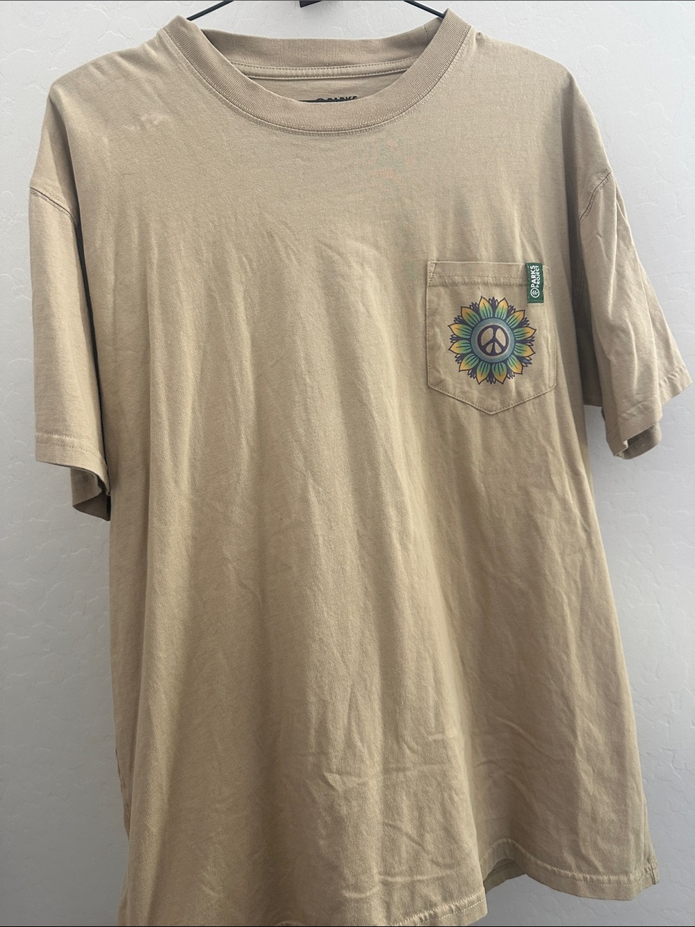 Parks Project Tan Pocket Tee with Sunflower Peace Graphic